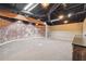 Finished basement showcasing exposed brick wall at 38 Timberlost Trl, Suwanee, GA 30024