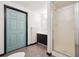 Basement bathroom with shower and dark vanity at 38 Timberlost Trl, Suwanee, GA 30024