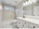 Clean bathroom, featuring a shower/tub combo and white vanity at 38 Timberlost Trl, Suwanee, GA 30024