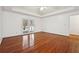 Spacious Primary bedroom with hardwood floors and access to backyard at 38 Timberlost Trl, Suwanee, GA 30024
