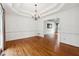 Bright dining room with hardwood floors and chandelier at 38 Timberlost Trl, Suwanee, GA 30024