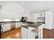 Spacious kitchen with large island, white cabinets and stainless steel appliances at 38 Timberlost Trl, Suwanee, GA 30024