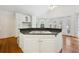 Kitchen with large island, white cabinets and stainless steel appliances at 38 Timberlost Trl, Suwanee, GA 30024