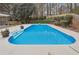 Refreshing blue pool with plenty of space for relaxation at 38 Timberlost Trl, Suwanee, GA 30024