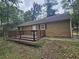 Private backyard with a wooden deck, perfect for outdoor relaxation at 8095 Flamingo Dr, Jonesboro, GA 30238