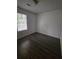 Cozy bedroom with wood-like floors and natural light at 8095 Flamingo Dr, Jonesboro, GA 30238