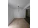 Bright dining room with tile floors and a modern light fixture at 8095 Flamingo Dr, Jonesboro, GA 30238