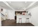 Basement bar with granite countertop, wine rack, and two bar stools at 5116 Barton Pass, Acworth, GA 30101