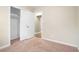 Bedroom with neutral walls, plush carpeting, and spacious closet at 876 Hutchens Se Rd, Atlanta, GA 30354