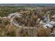 Aerial view of the neighborhood with winding road at 1198 Mado Loop, Chattahoochee Hills, GA 30268