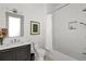 Modern bathroom with white subway tile, vanity, and tub/shower combo at 1198 Mado Loop, Chattahoochee Hills, GA 30268