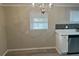 Kitchen with white cabinets, marble countertops, and a chandelier at 1543 California Ave, Conley, GA 30288