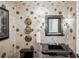 Stylish powder room with black vanity and decorative wallpaper at 1 Brookhaven Ne Dr # 301, Atlanta, GA 30319