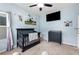 Charming baby's room with a crib, changing table, and wall-mounted TV at 111 Bryon Ln, Acworth, GA 30102