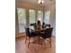 Breakfast nook with wood floors and a small table with four chairs at 5062 N Woodbridge Trl, Stone Mountain, GA 30088