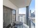 Balcony with city views, sliding glass door, and space for a small table and chairs at 1280 W Peachtree Nw St # 1003, Atlanta, GA 30309