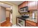 Contemporary kitchen featuring stainless steel appliances and granite countertops at 1280 W Peachtree Nw St # 1003, Atlanta, GA 30309