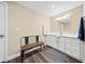 Elegant bathroom with a modern vanity and bench at 3420 Aviary Ln, Acworth, GA 30101