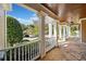 Stone porch with white columns, offering a view of the neighborhood at 3420 Aviary Ln, Acworth, GA 30101