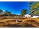 Large backyard with fire pit, pool, and riding arena at 3625 Pointer Rd, Loganville, GA 30052