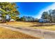 Open farmland with a windmill and outbuildings at 3625 Pointer Rd, Loganville, GA 30052