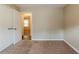 Empty bedroom with neutral walls, carpet, and closet at 450 Valley Woods Se Cir, Conyers, GA 30094