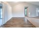The dining room features durable wood-look flooring, sliding glass doors to the screened porch, and vaulted ceiling at 5136 Huxley Rd, Stone Mountain, GA 30088