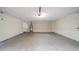 Attached two-car garage with a door and water heater at 5136 Huxley Rd, Stone Mountain, GA 30088
