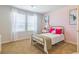 Cozy bedroom with gold bed frame and pink accent wall at 802 Major Oak Ct, Villa Rica, GA 30180