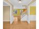 Foyer with hardwood floors, wainscoting, and a staircase leading to the second floor at 1558 Park Knoll Trl, Lawrenceville, GA 30043