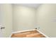 Laundry room with vinyl wood-look flooring and ample space at 1558 Park Knoll Trl, Lawrenceville, GA 30043