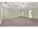 Spacious main bedroom with tray ceiling and plush carpet at 1558 Park Knoll Trl, Lawrenceville, GA 30043