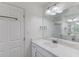 Clean bathroom with white vanity, marble countertop, and large mirror at 3263 Long Iron Place, Lawrenceville, GA 30044