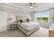 Spacious main bedroom with plush carpet and tray ceiling at 443 Village Ln, Fairburn, GA 30213