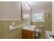 Bathroom featuring tiled walls, single vanity, toilet, and bathtub at 4485 Canary Ct, Lithia Springs, GA 30122