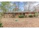 Brick ranch-style home with red shutters and front porch at 4485 Canary Ct, Lithia Springs, GA 30122