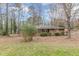 Front exterior view of a traditional brick home with a grassy lawn at 4485 Canary Ct, Lithia Springs, GA 30122