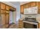 Kitchen with stainless steel appliances, wood cabinets, and pantry at 4485 Canary Ct, Lithia Springs, GA 30122