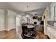 Bright dining area with wood floors and a round table at 4488 Mantova Dr, Buford, GA 30519