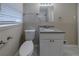 Clean bathroom featuring white vanity, granite countertop, and updated fixtures at 2131 Meador Se Ave, Atlanta, GA 30315