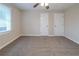 Spacious bedroom with ceiling fan, plush carpeting, and ample natural light at 2131 Meador Se Ave, Atlanta, GA 30315