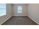 Simple bedroom with neutral walls, carpeting, and a large window at 2131 Meador Se Ave, Atlanta, GA 30315