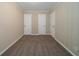 Empty bedroom with neutral walls, plush carpeting, and multiple closets at 2131 Meador Se Ave, Atlanta, GA 30315