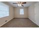 Large bedroom with plush carpeting, ceiling fan, and two windows offering natural light at 2131 Meador Se Ave, Atlanta, GA 30315