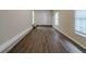 Bonus room with wood-look flooring, white walls, and multiple windows at 2131 Meador Se Ave, Atlanta, GA 30315