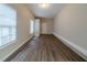 Bonus room with durable wood-look flooring and several large windows offering natural light at 2131 Meador Se Ave, Atlanta, GA 30315