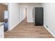 View of the kitchen with wood-look flooring and a hallway leading to another room at 2131 Meador Se Ave, Atlanta, GA 30315