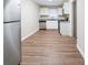 Updated kitchen featuring white cabinets, stainless steel appliances, and wood-look flooring at 2131 Meador Se Ave, Atlanta, GA 30315