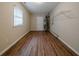 Laundry room with wood-look flooring, shelving for storage, and water heater at 2131 Meador Se Ave, Atlanta, GA 30315