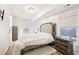 Bedroom with tufted headboard, wooden furniture and plush rug at 716 Connally Se St, Atlanta, GA 30315